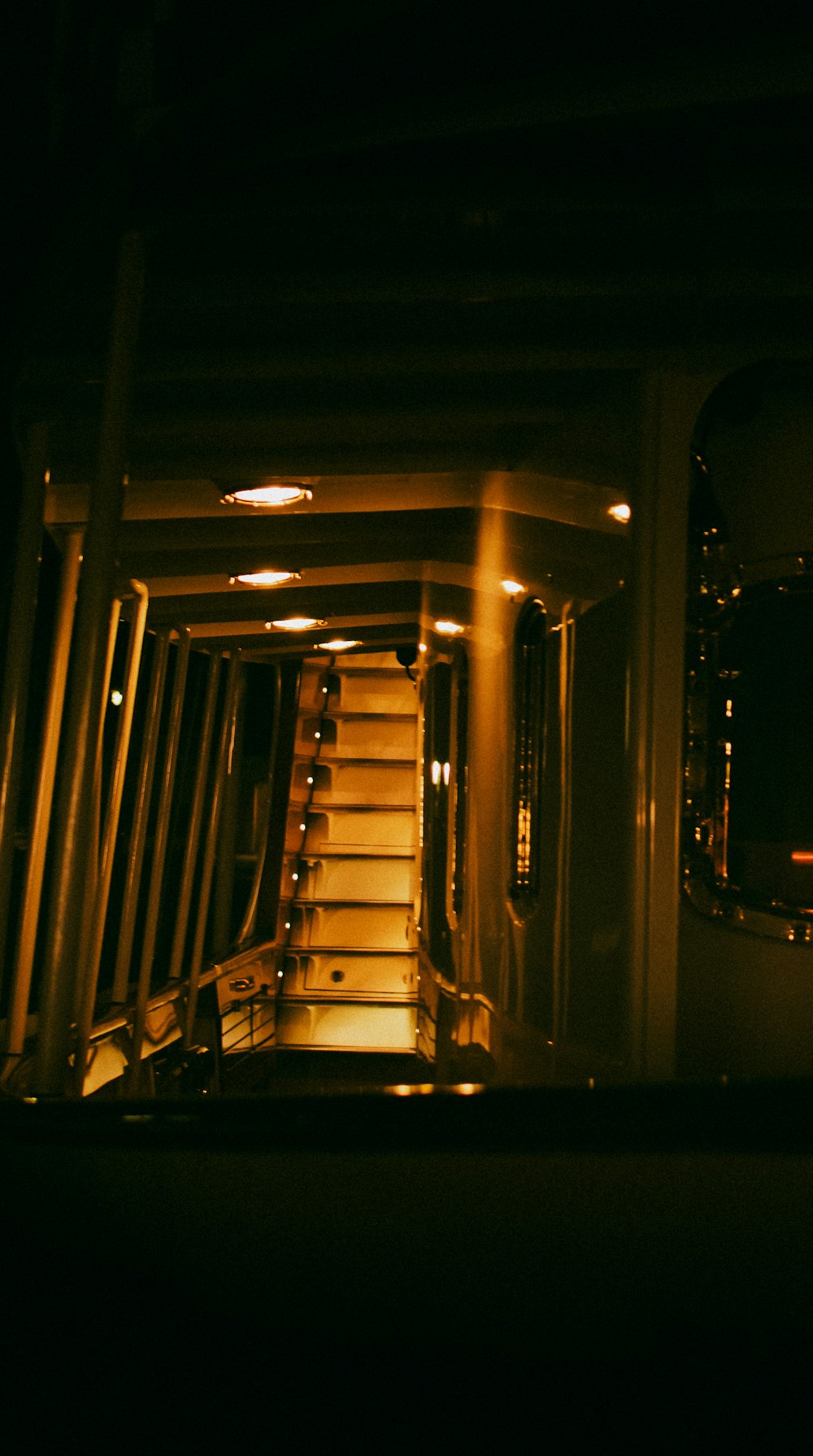 a stairway is lit up in the dark