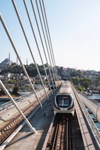 a train on a track going over a bridge