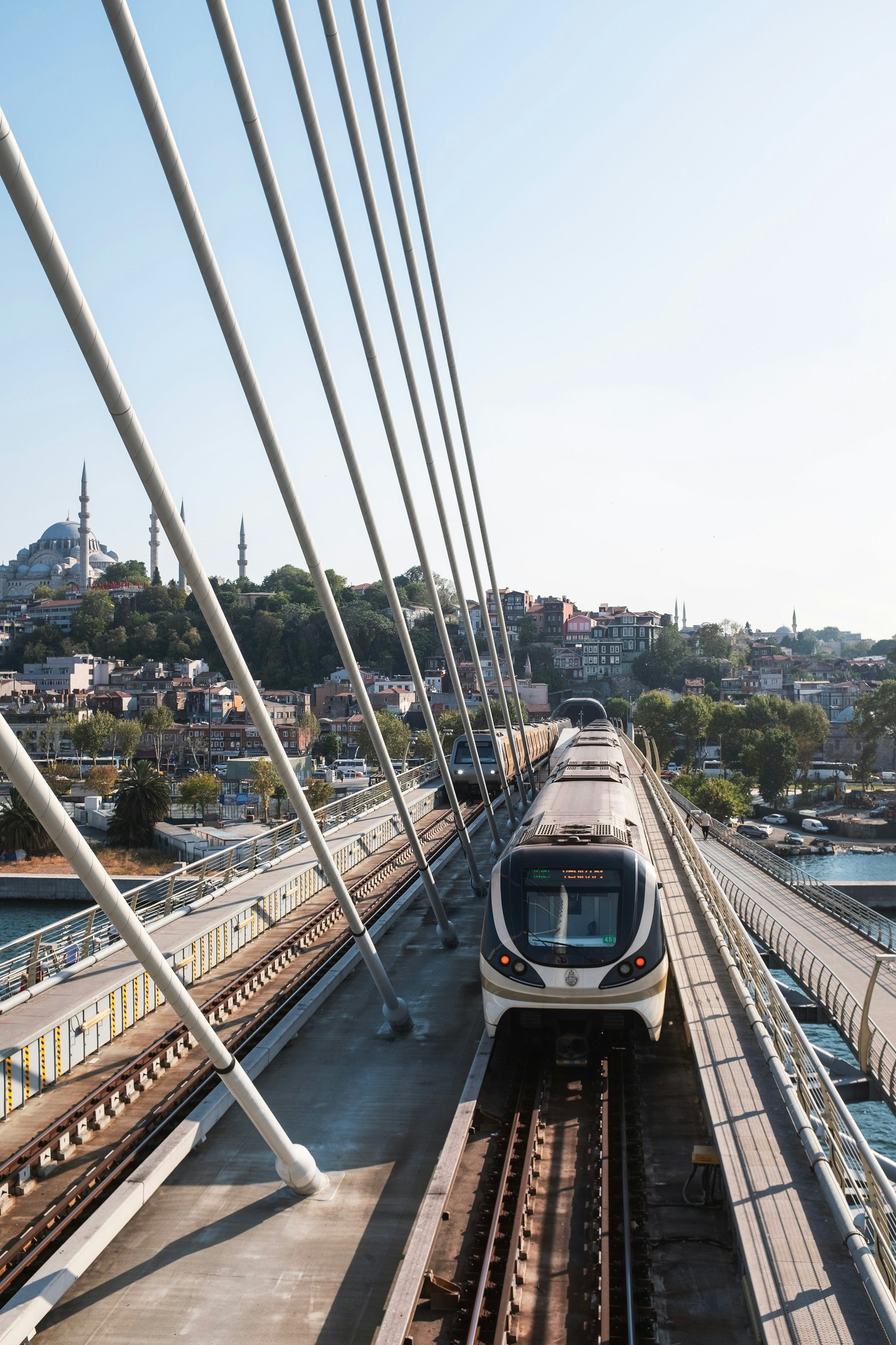 a train on a track going over a bridge