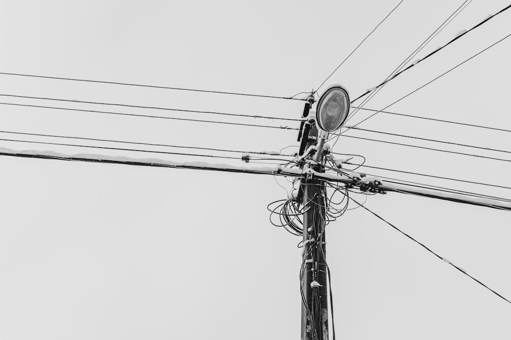 a black and white photo of a street light