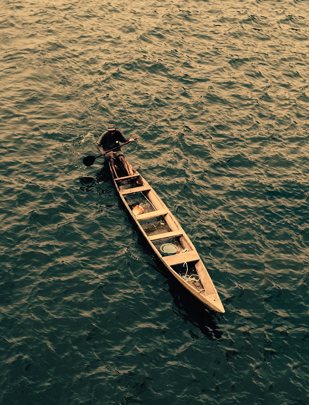a row boat in the middle of a body of water