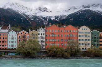 a bunch of buildings that are next to a body of water