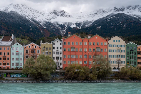 a bunch of buildings that are next to a body of water