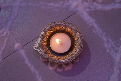 A beautifully arranged gift hamper featuring metal candle holders and decorative accents.