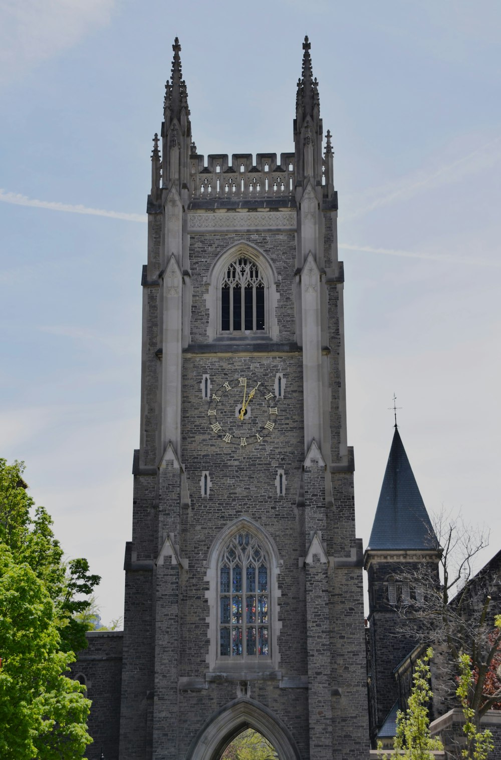 a very tall clock tower with a clock on each of it's sides