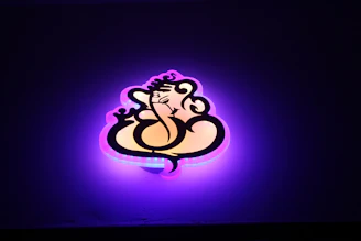 A radiant purple background featuring the Ra symbol glowing softly with golden accents.