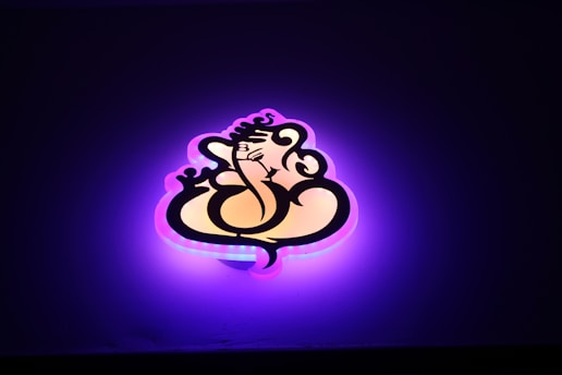 A glowing golden gnostic symbol against a deep purple background, radiating light and mystery.