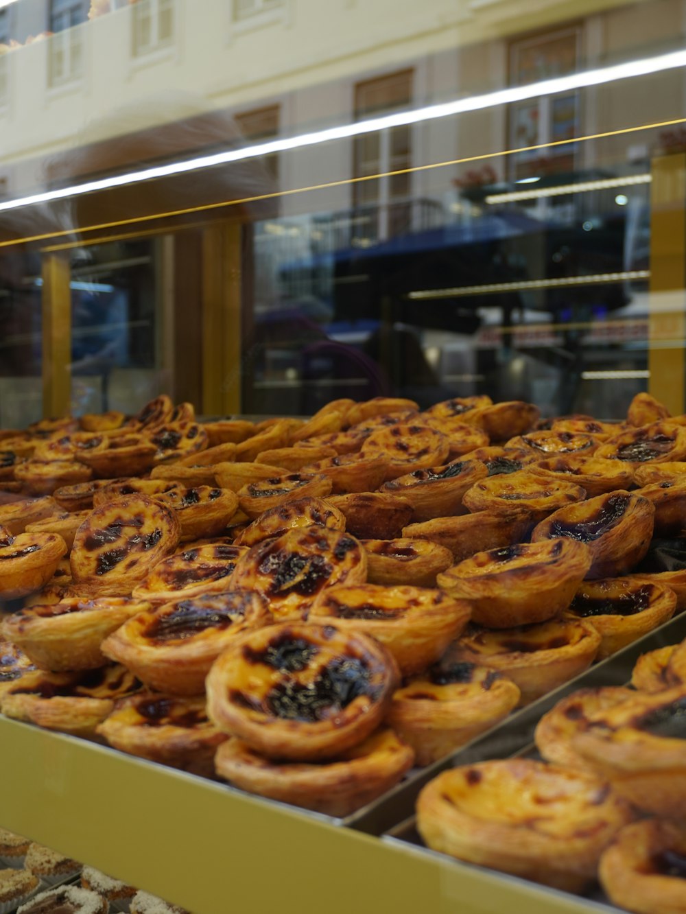 a display case filled with lots of pastries