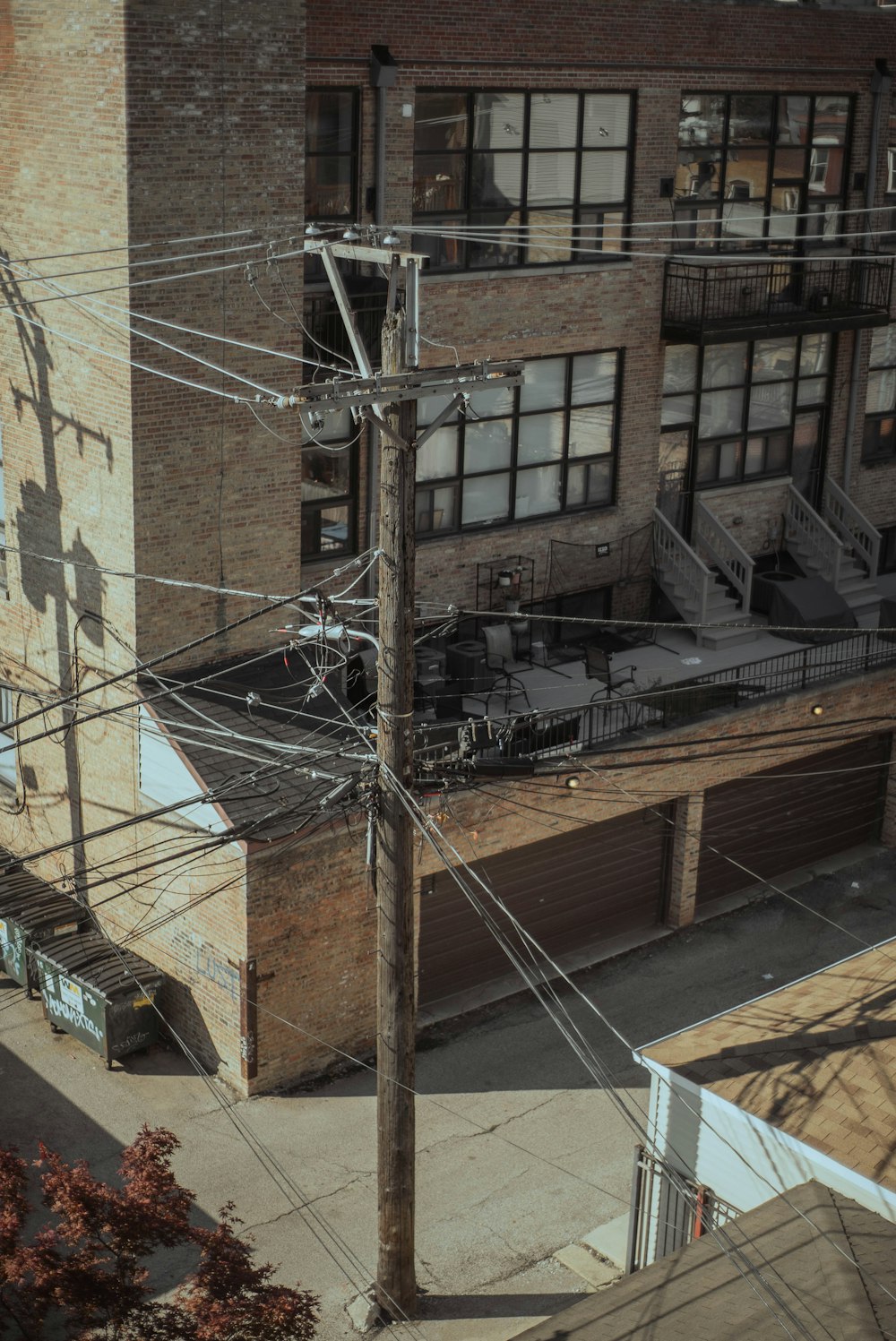 an overhead view of a building with lots of power lines