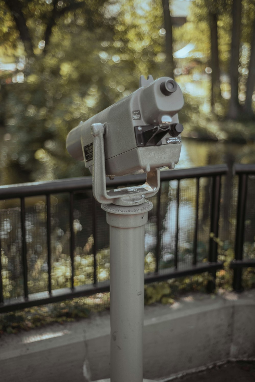 a close up of a telescope on a pole