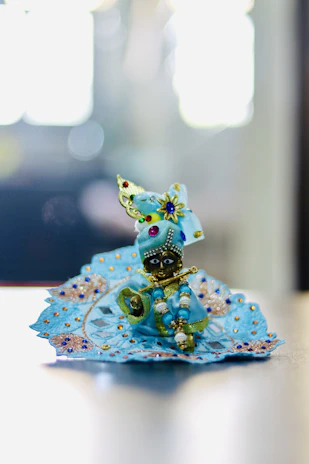 Artisan hands carefully polishing a brass Lakshmi idol, highlighting fine details.