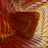 A digital abstract art piece characterized by swirling and layered textures. The predominant colors are warm reds, yellows, and oranges, creating a sense of depth and movement. The patterns are intricate, resembling folds or waves.