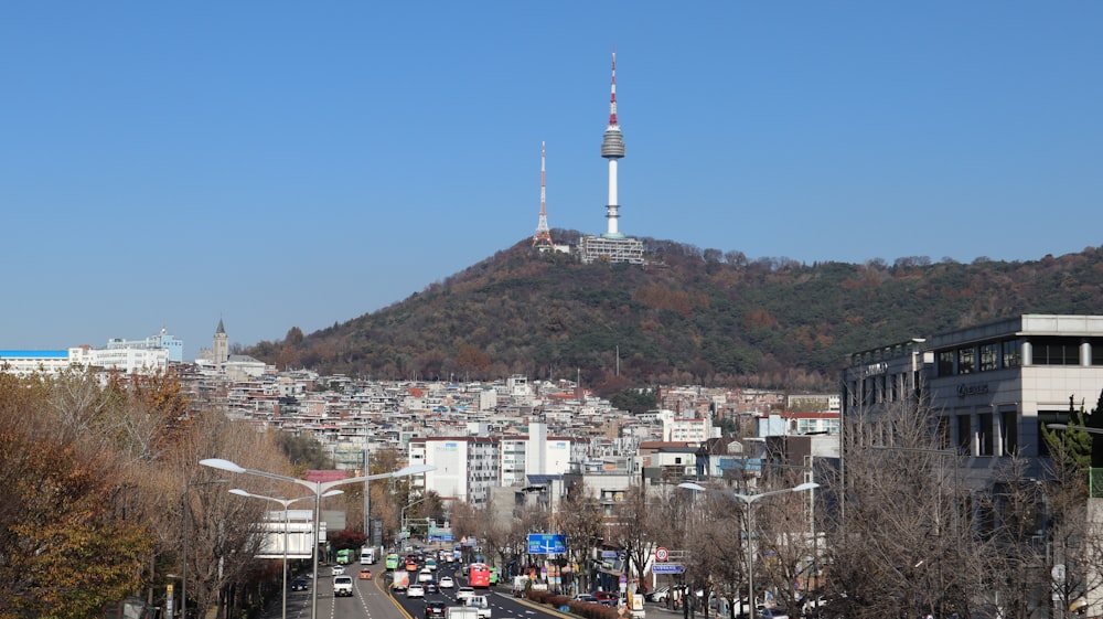 a view of a city with a hill in the background