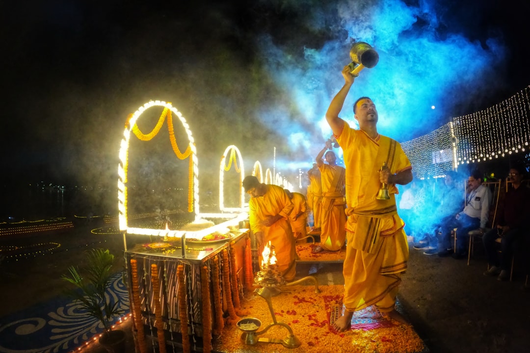 a group of men dressed in yellow performing a dance,