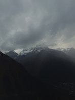 A moody, atmospheric photo of snow-covered mountain slopes hinting at the setting of 'Mandate on the Slopes.'