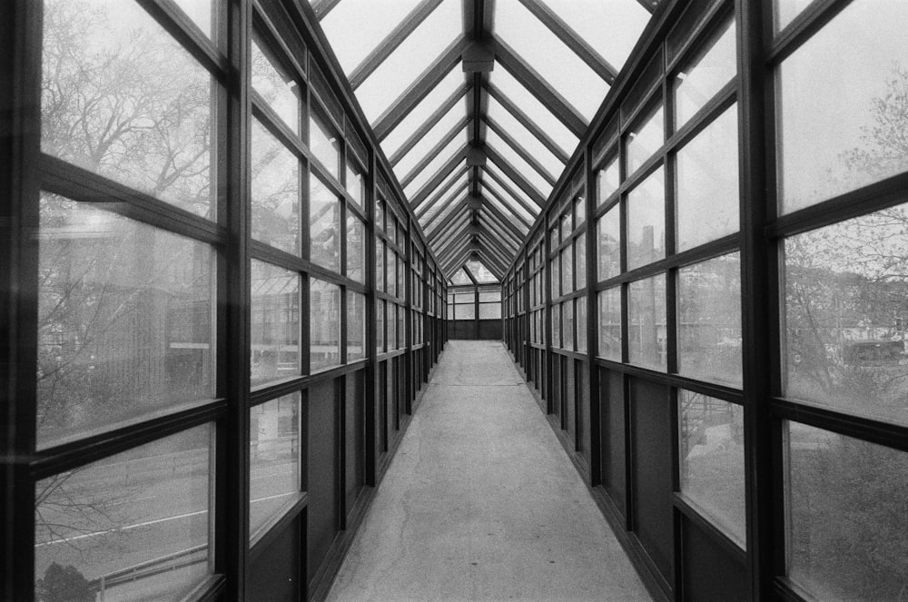 a black and white photo of a long hallway