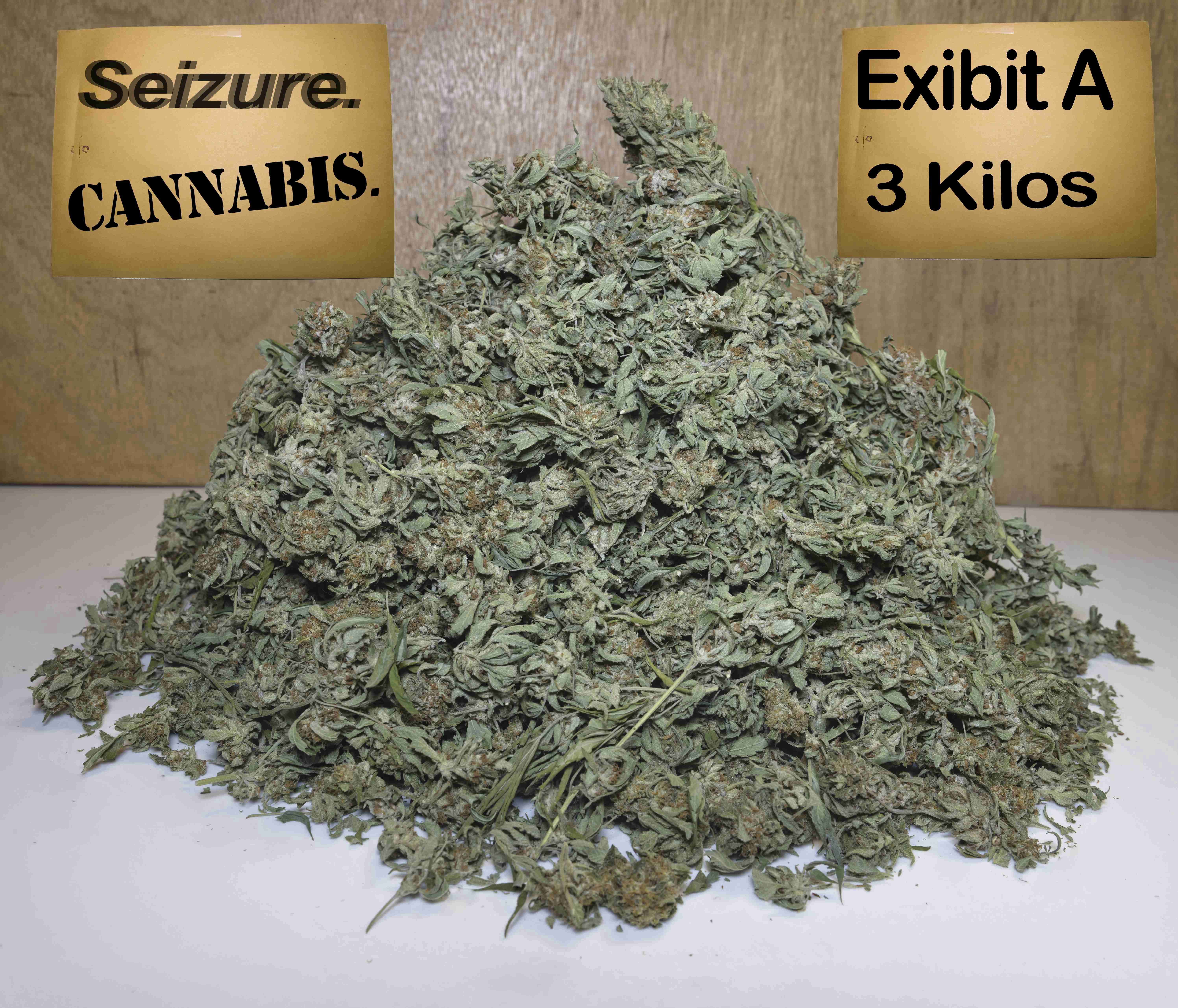 a pile of marijuana sitting on top of a table, Cannabis seized at airport