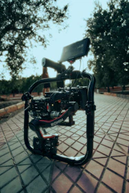 A sleek gimbal stabilizer setup capturing a scenic outdoor event with vibrant colors.