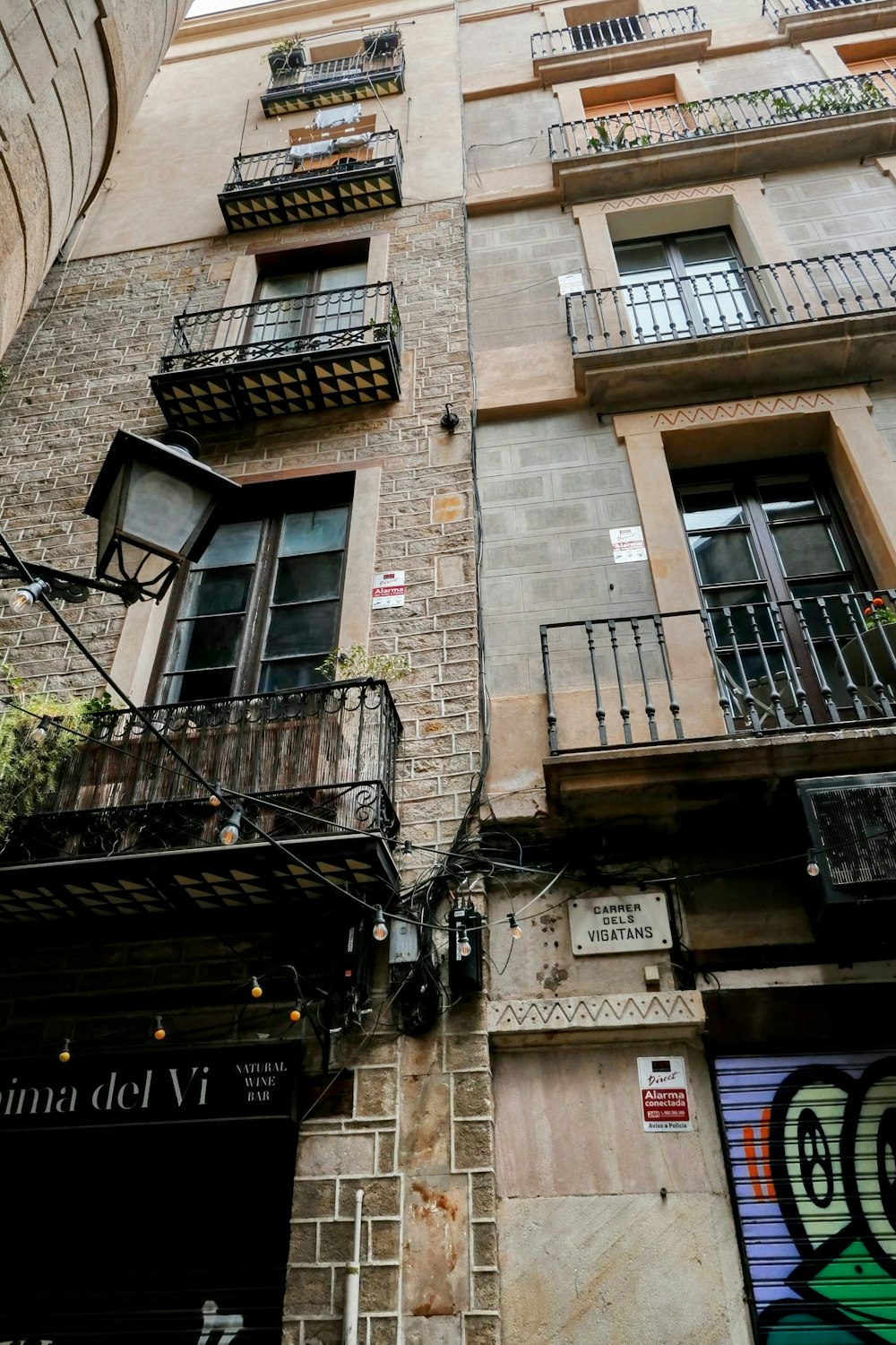 a tall brick building with balconies and balconies