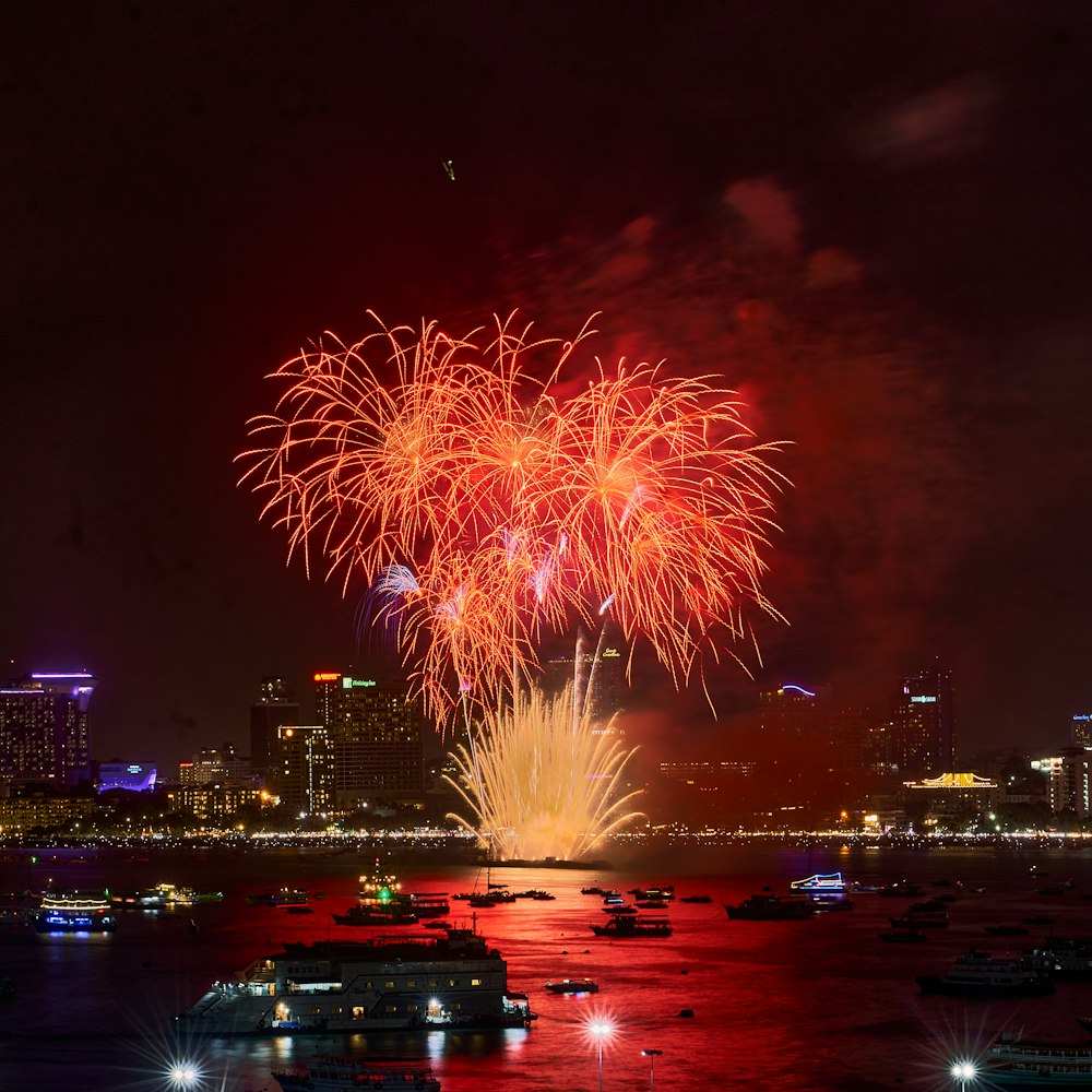 a fireworks display over a city at night