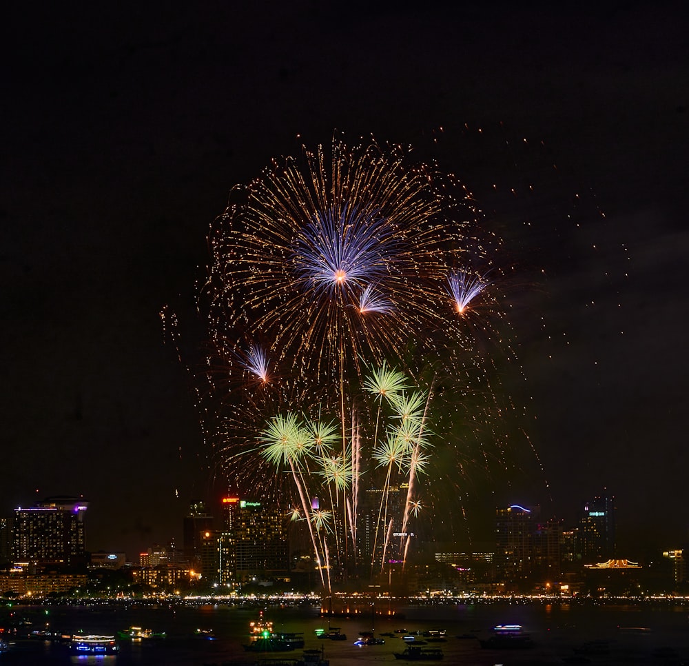 a fireworks display over a city at night