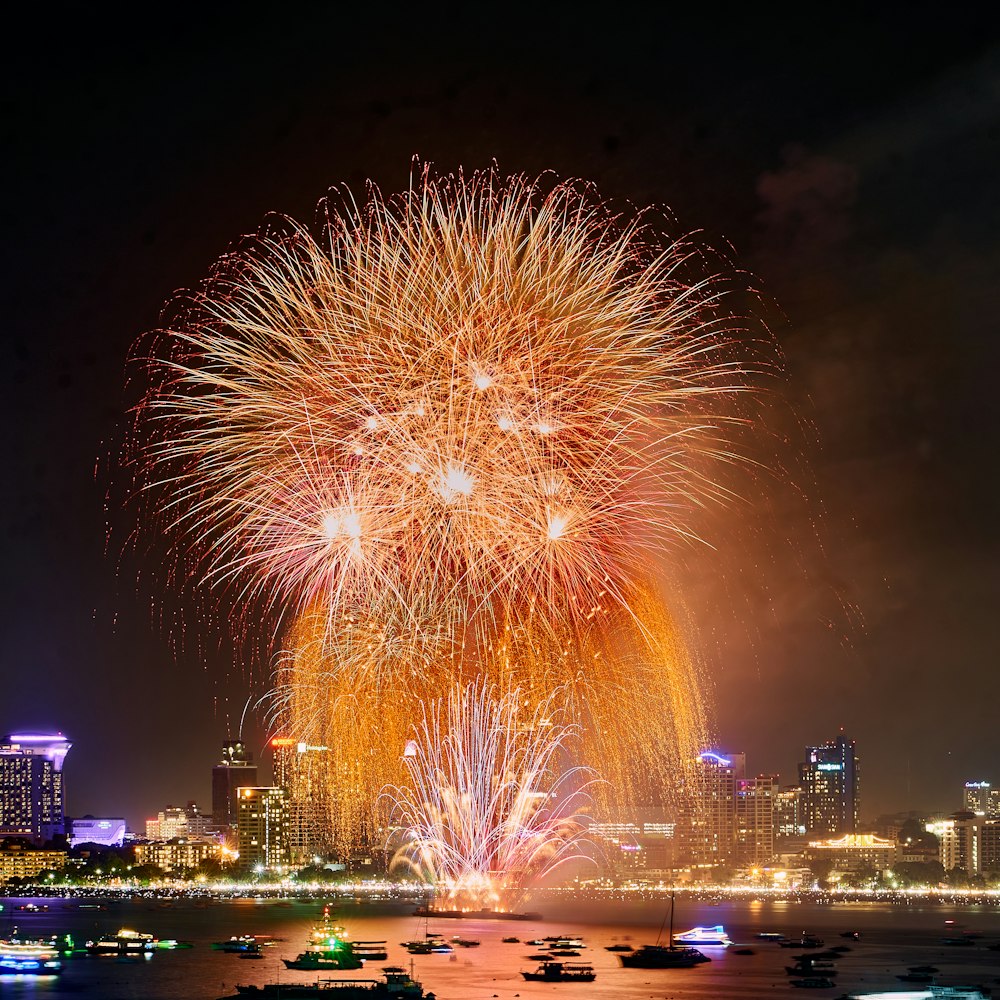a large fireworks display over a city at night