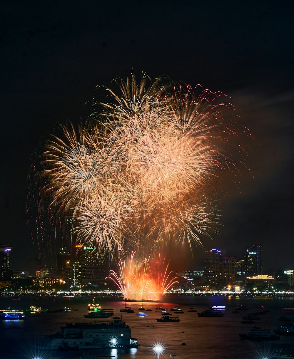 a large fireworks display over a city at night