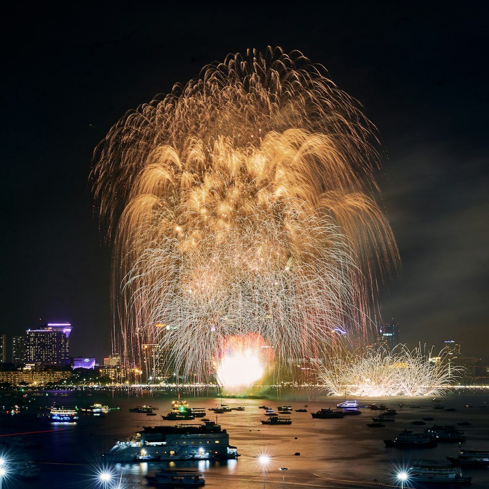 a large fireworks display over a city at night