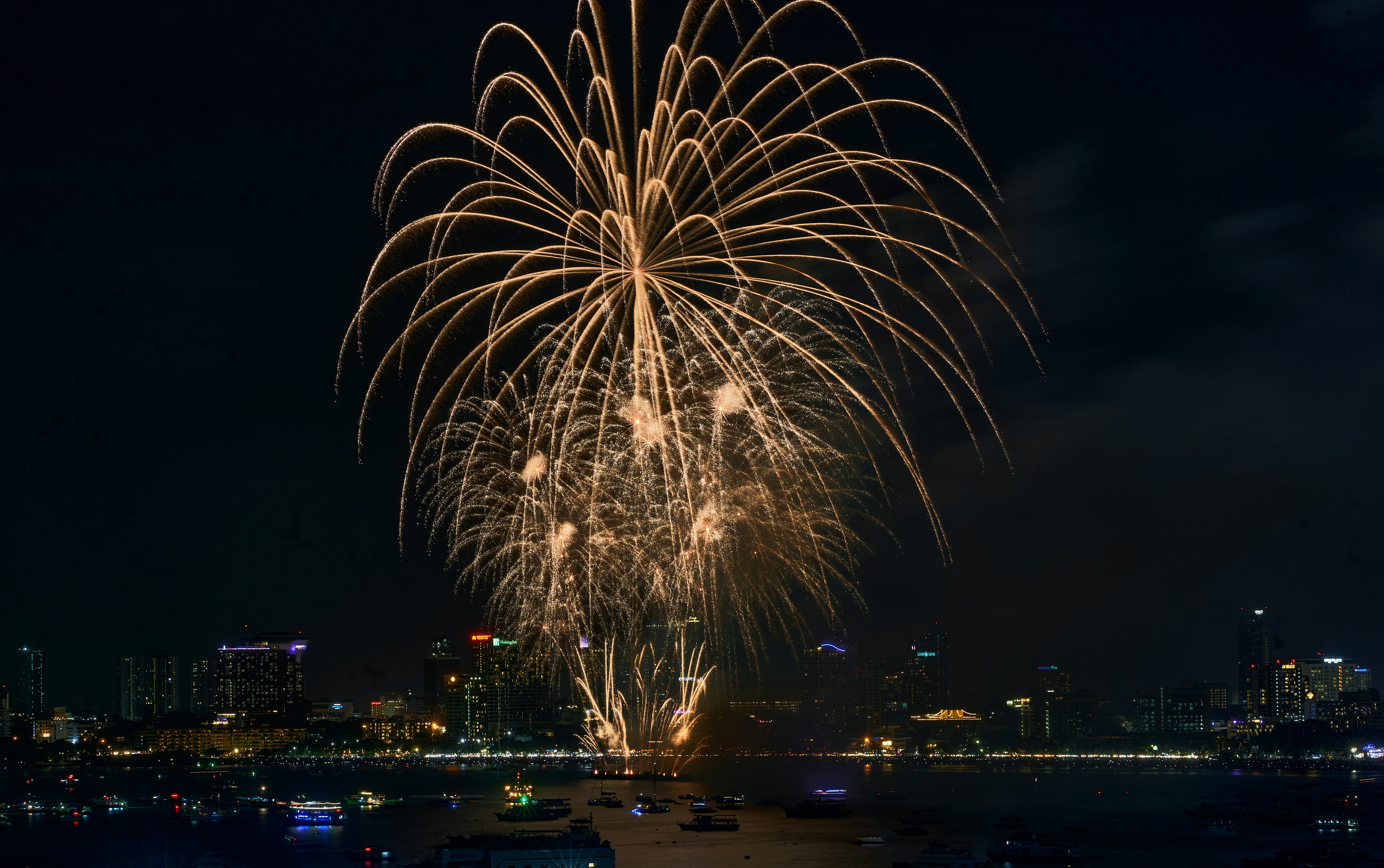 a fireworks display over a city at night