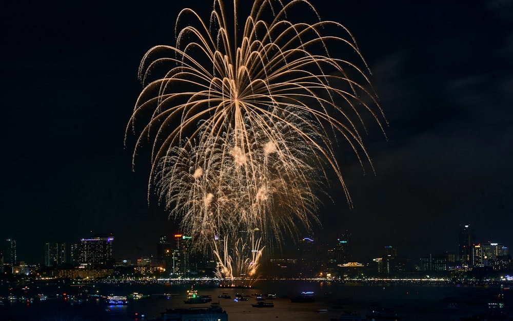 a fireworks display over a city at night