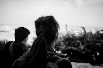 a couple of people that are sitting on a bench