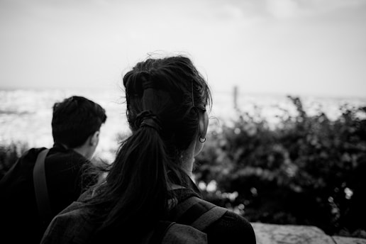 a couple of people that are sitting on a bench