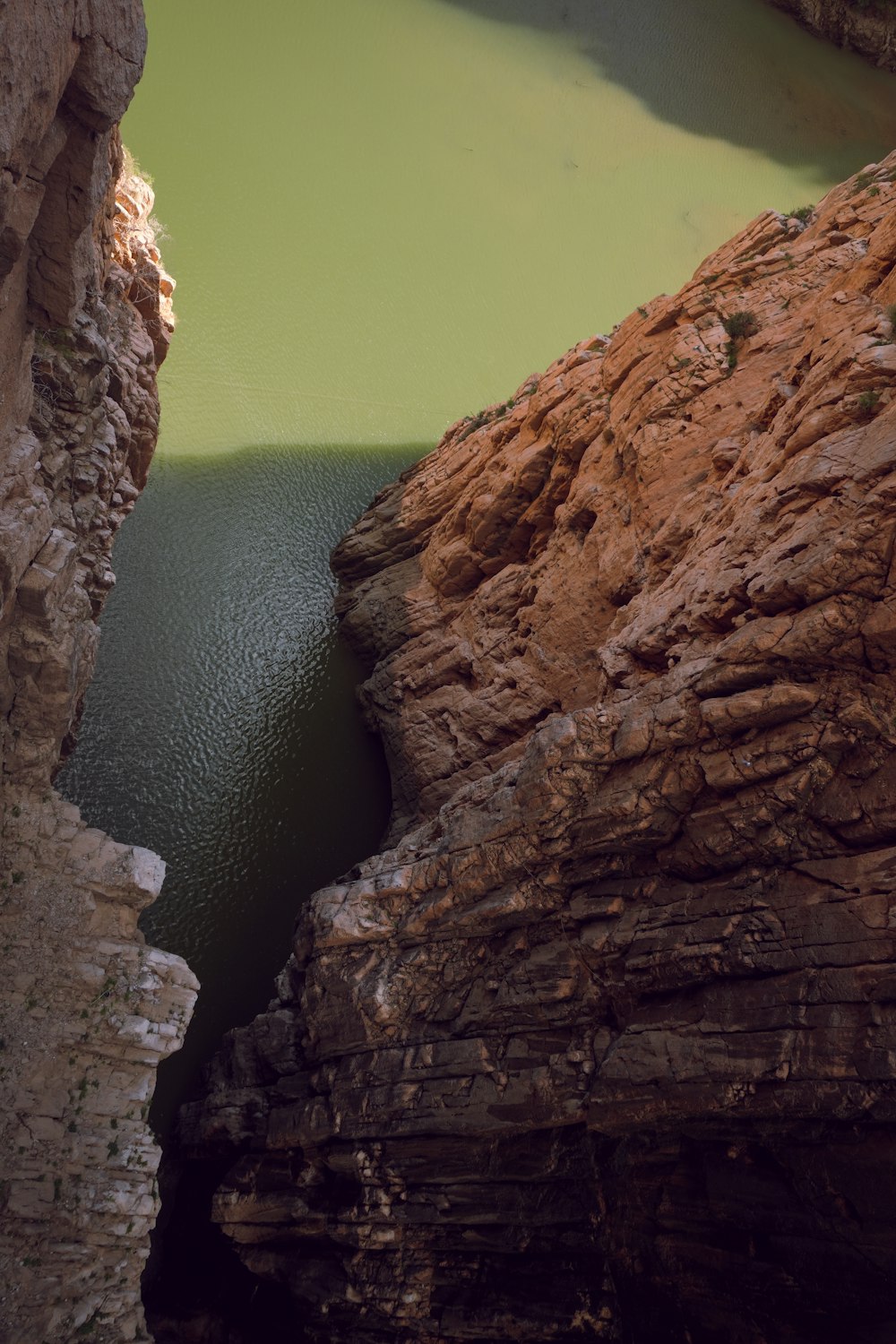 a large body of water surrounded by rocks