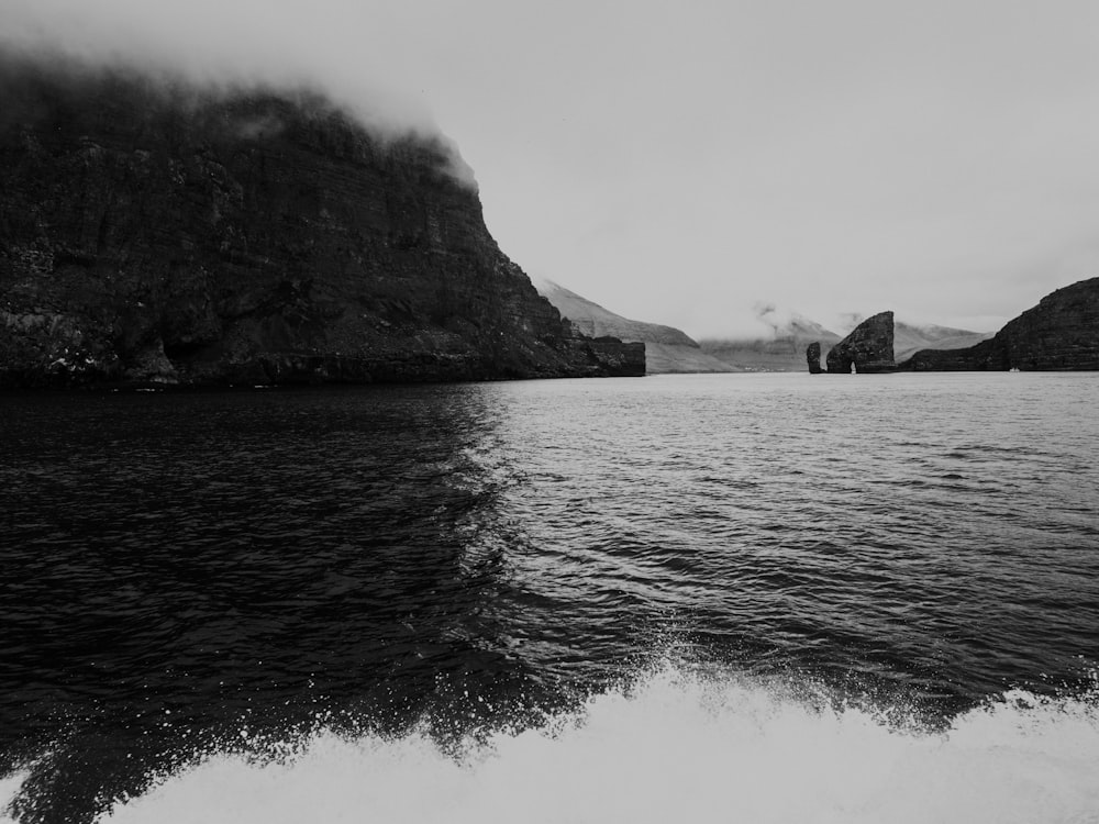 a black and white photo of a body of water