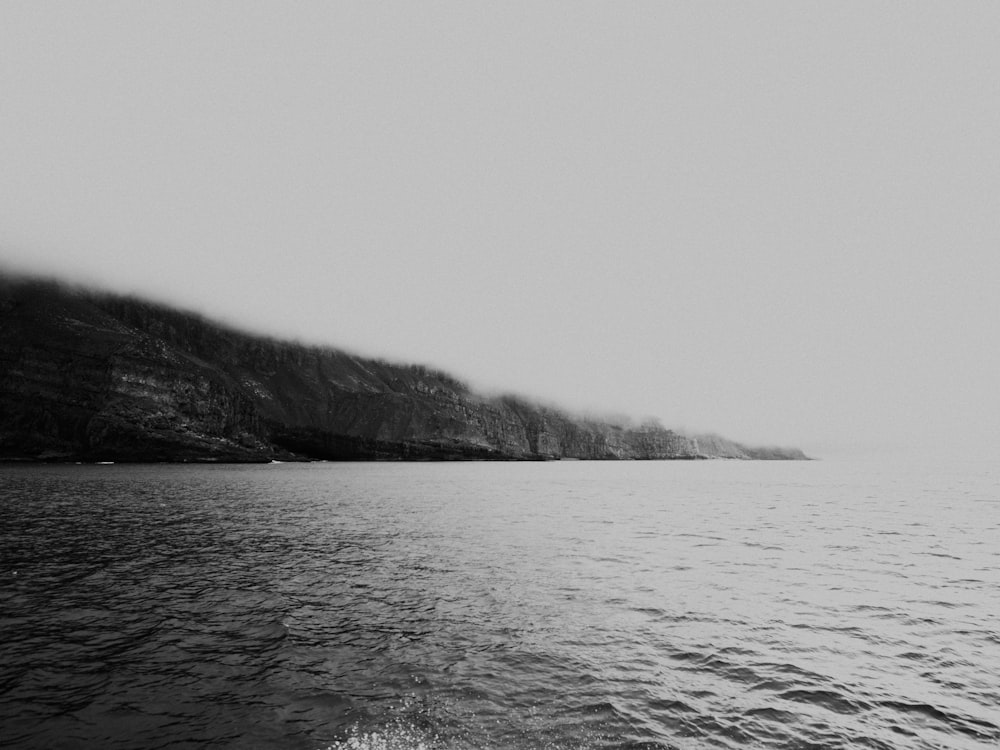 a black and white photo of a body of water