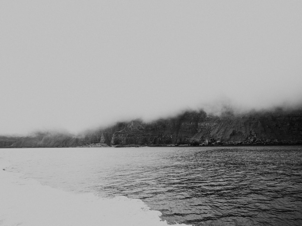 a black and white photo of a body of water