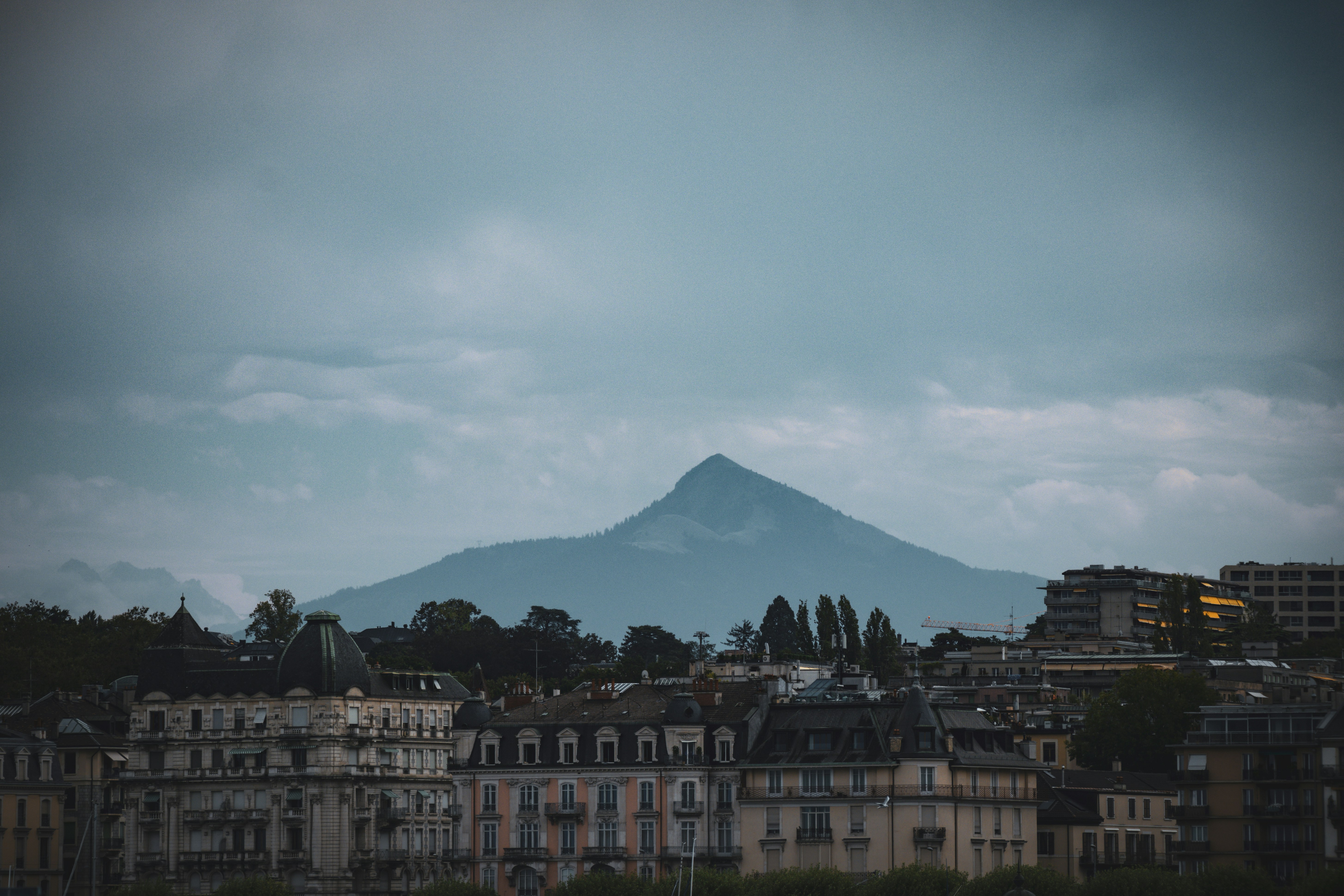 a view of a city with a mountain in the background