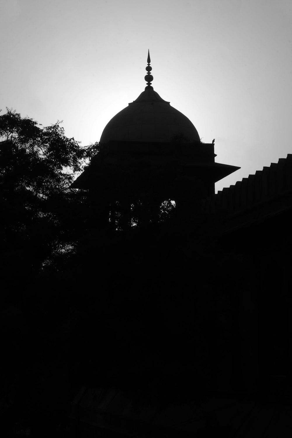 a black and white photo of a building with a dome