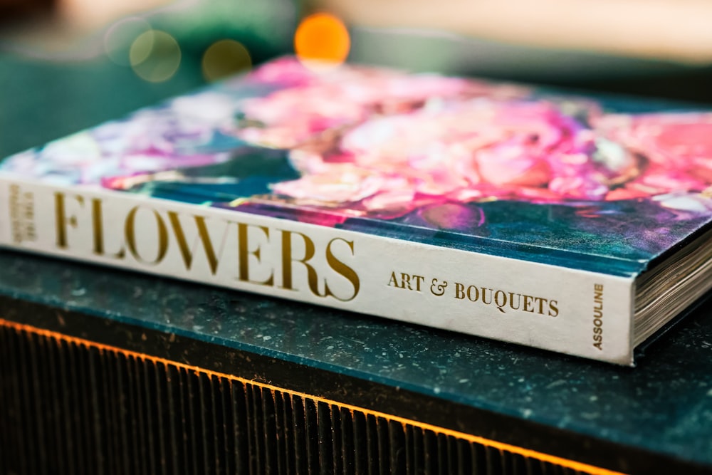 a book sitting on top of a green table