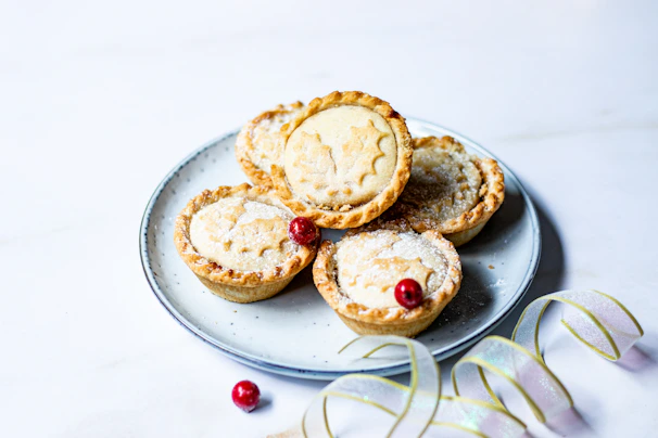 An overhead shot of assorted mini pies arranged on a colorful plate, inviting to try them all.