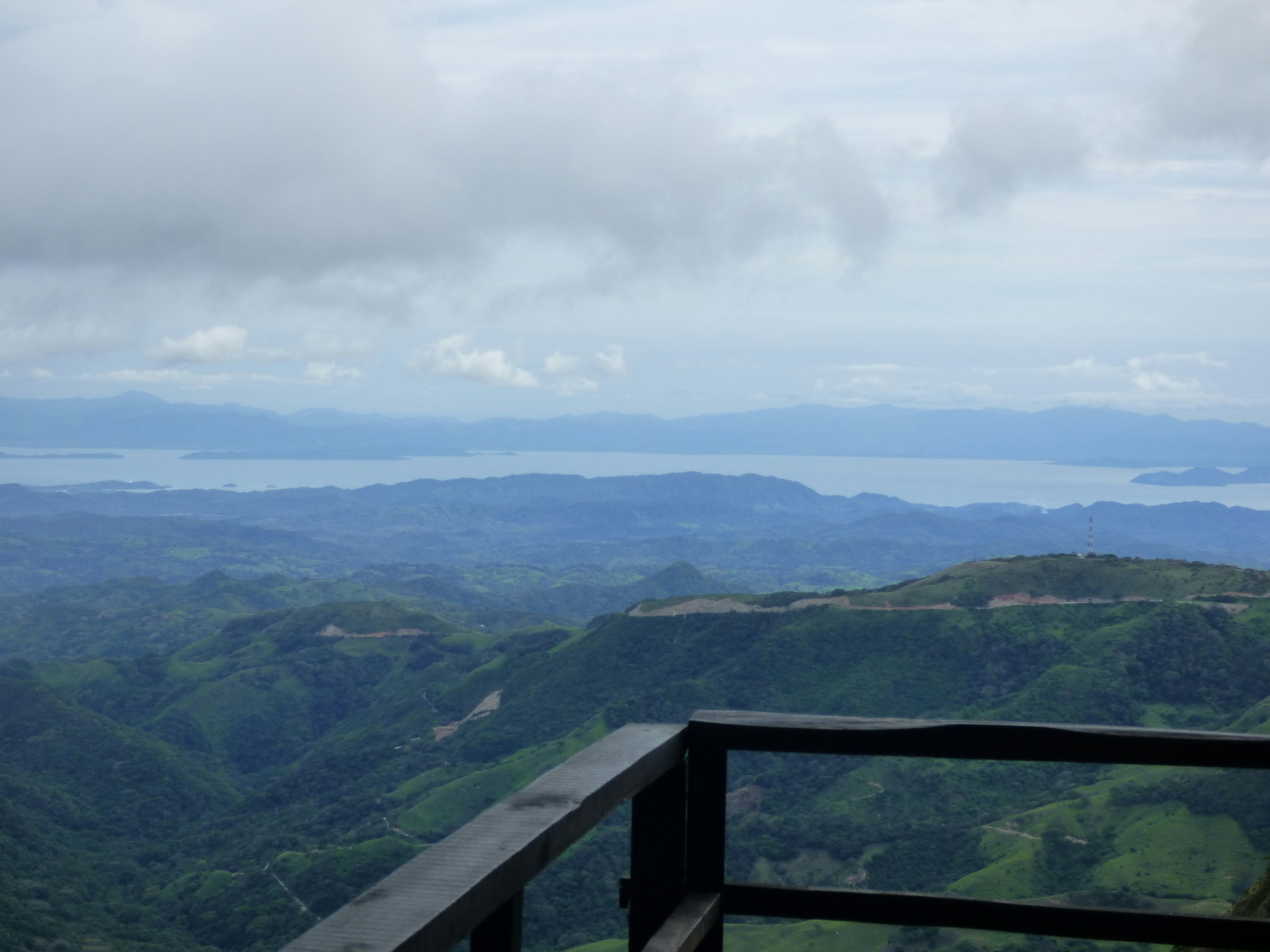 a view of a mountain range with a lake in the distance, Monteverde lookout, Costa Rica