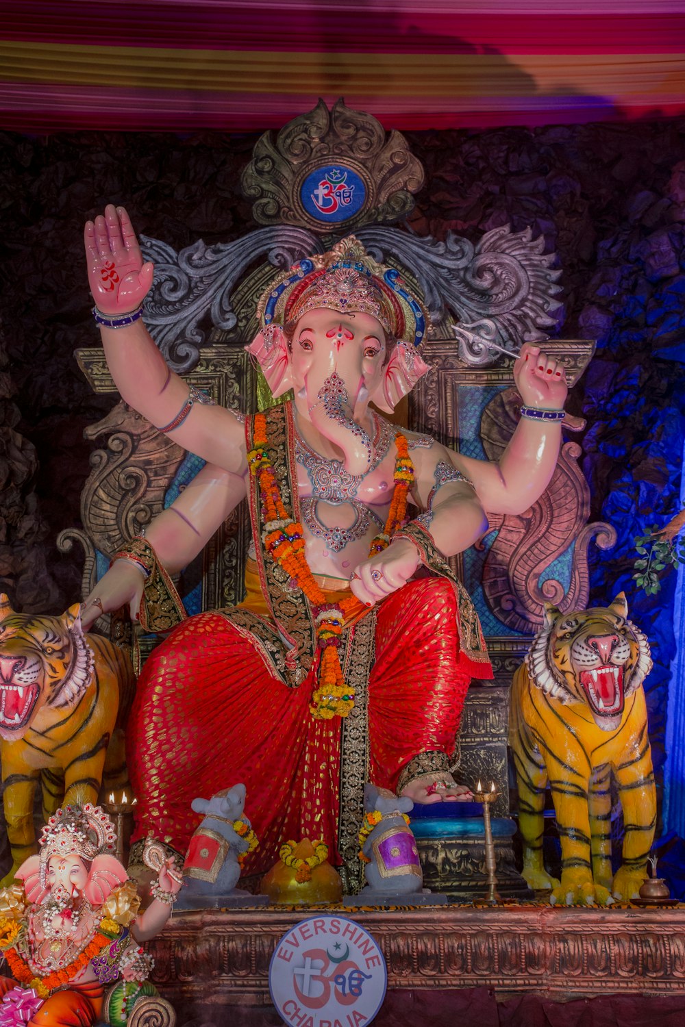 a statue of a man sitting on top of a tiger