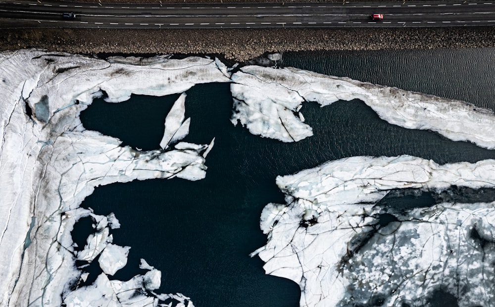 an aerial view of a car driving on a road