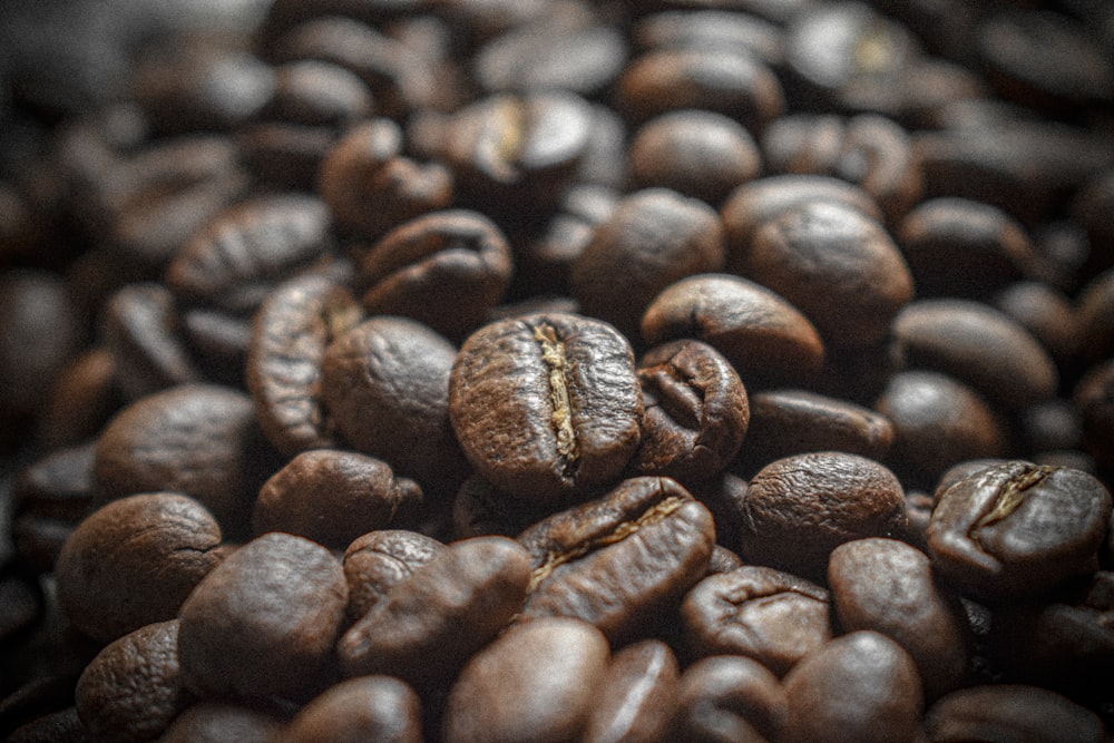 a pile of coffee beans sitting on top of each other