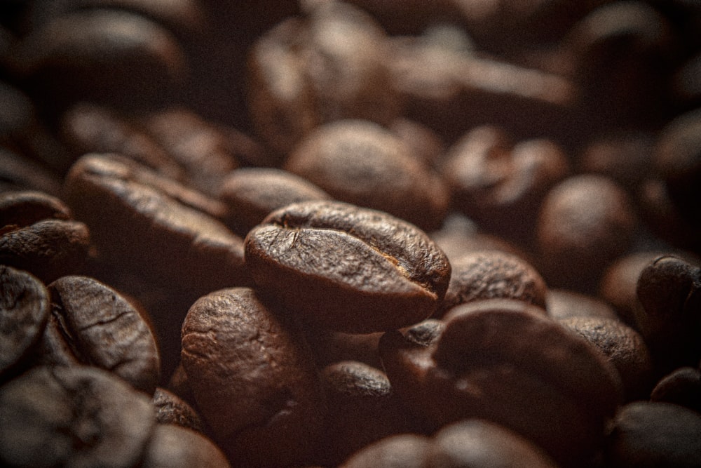 a pile of coffee beans sitting on top of each other
