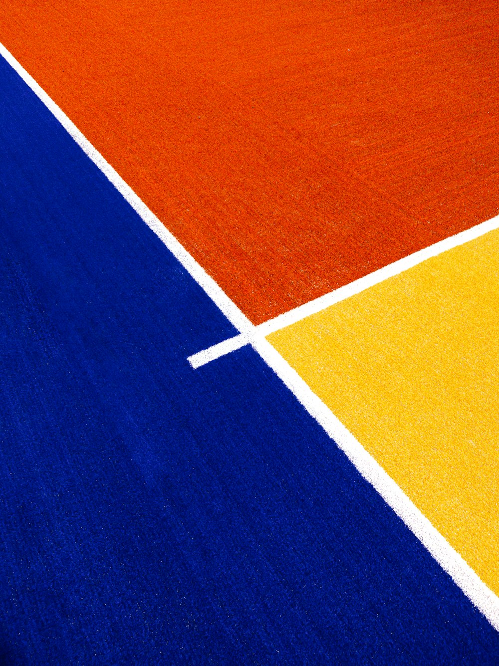 a close up of a tennis court with a white line