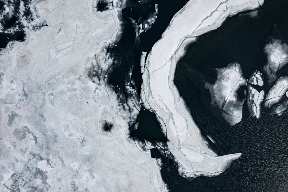 an aerial view of a body of water covered in ice