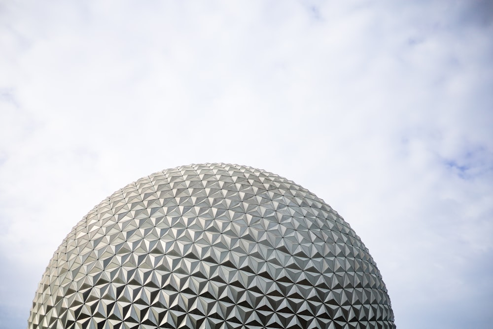 a close up of a building with a sky background