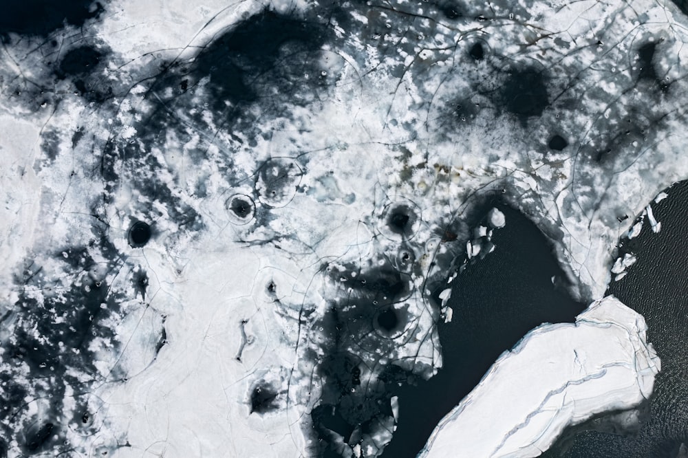 an aerial view of a body of water covered in ice