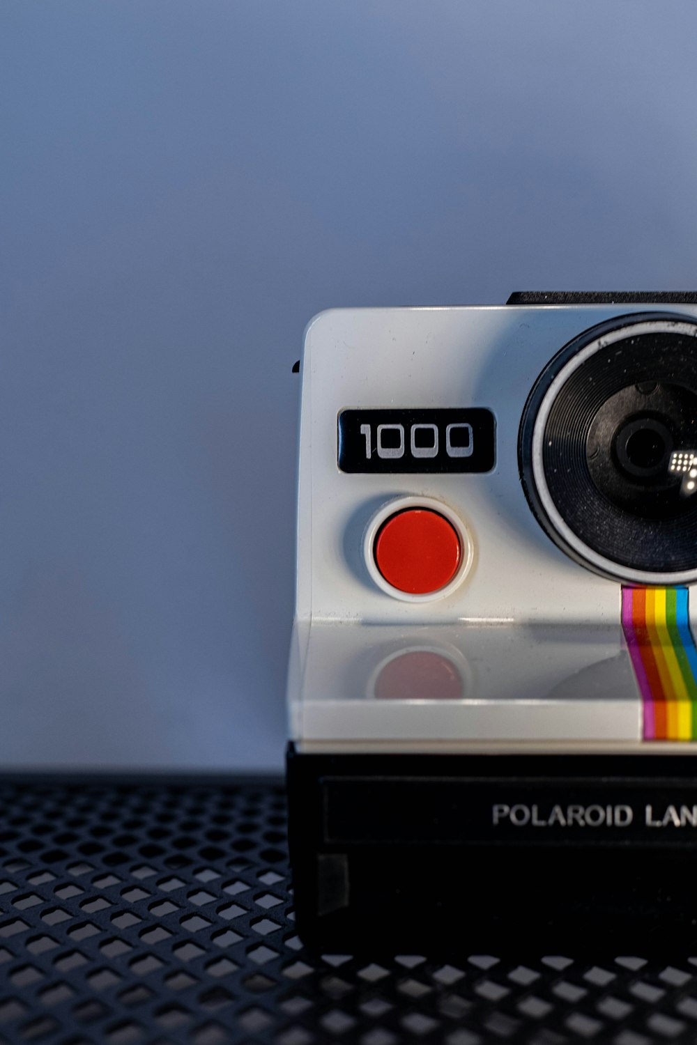a polaroid land camera sitting on top of a table